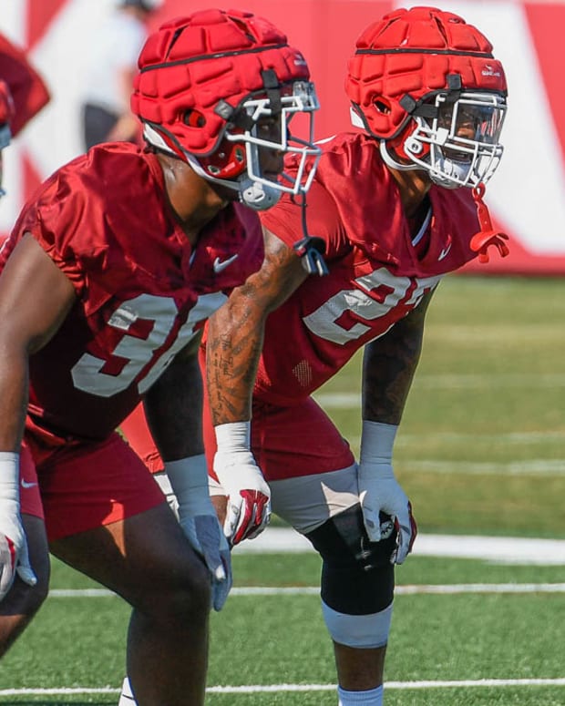 Razorback linebackers Jordan Crook, Chris "Pooh" Paul and Jaheim Thomas in practice Friday